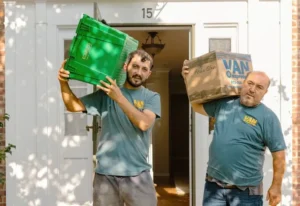 2 men carrying EcoBins